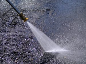 Power washing uses hot water to rid areas of dirt and debris